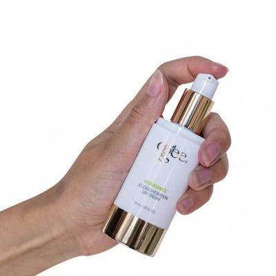 hand pumping ogee jojoba day cream organic natural skincare facial moisturizer